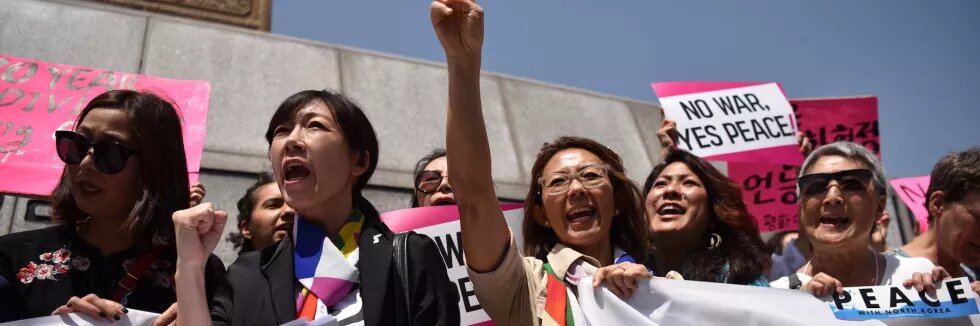 Women Cross DMZ at a demonstration outside the US Embassy in Seoul, 25 May 2018. 